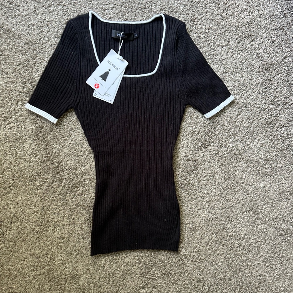 Elegant Black Ribbed Top with White Trim